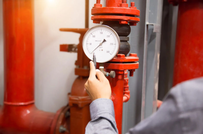 Testing water pressure with a gauge